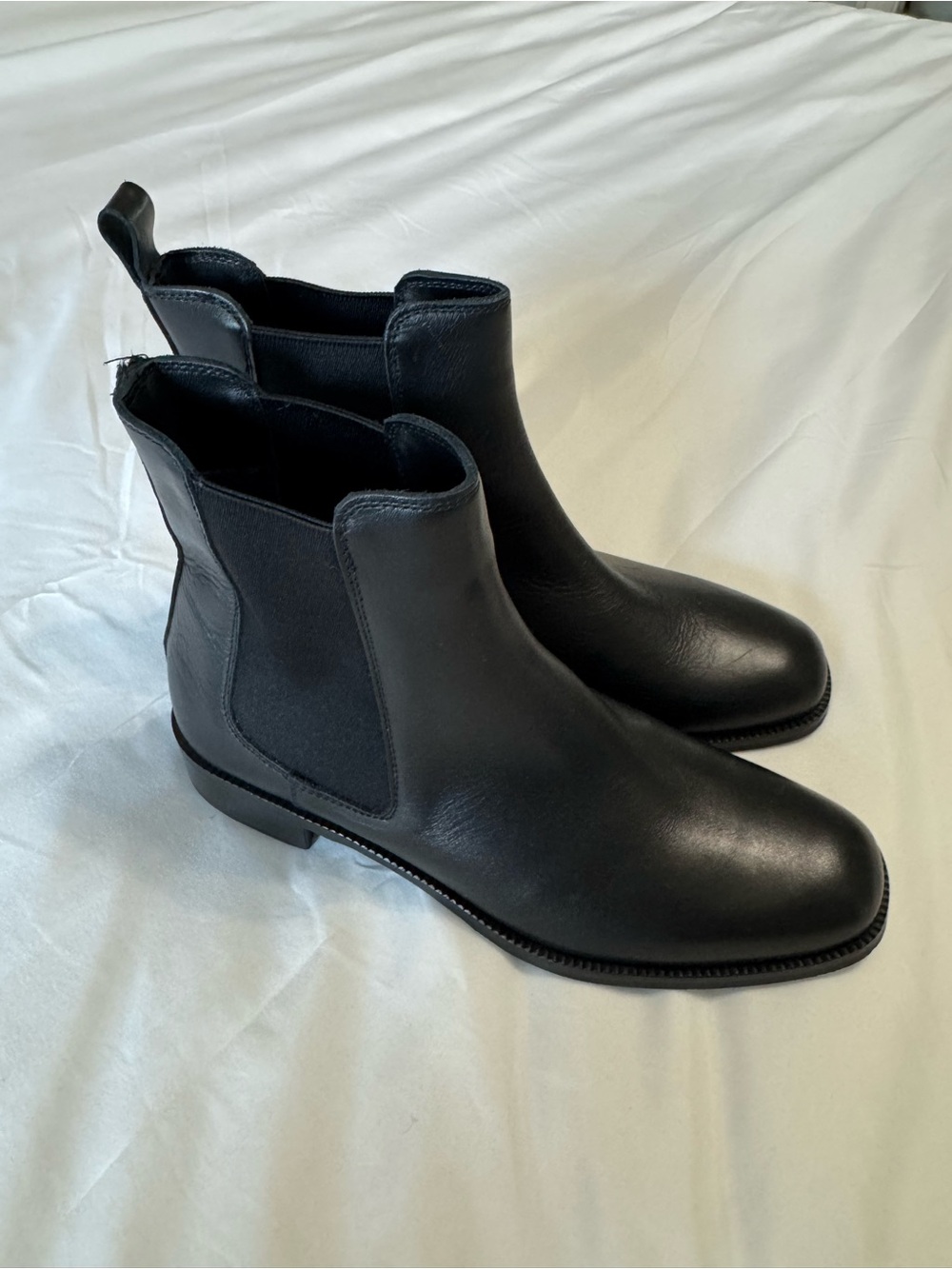 La CANADIENNE Black Leather Ankle Boots. Missing the pull strap on the right